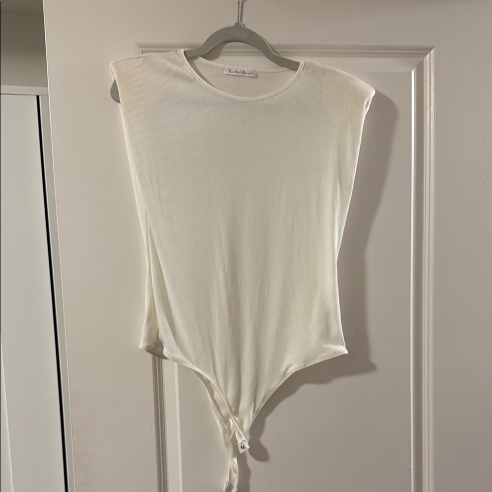 White sleeveless bodysuit with crew neck and tie front